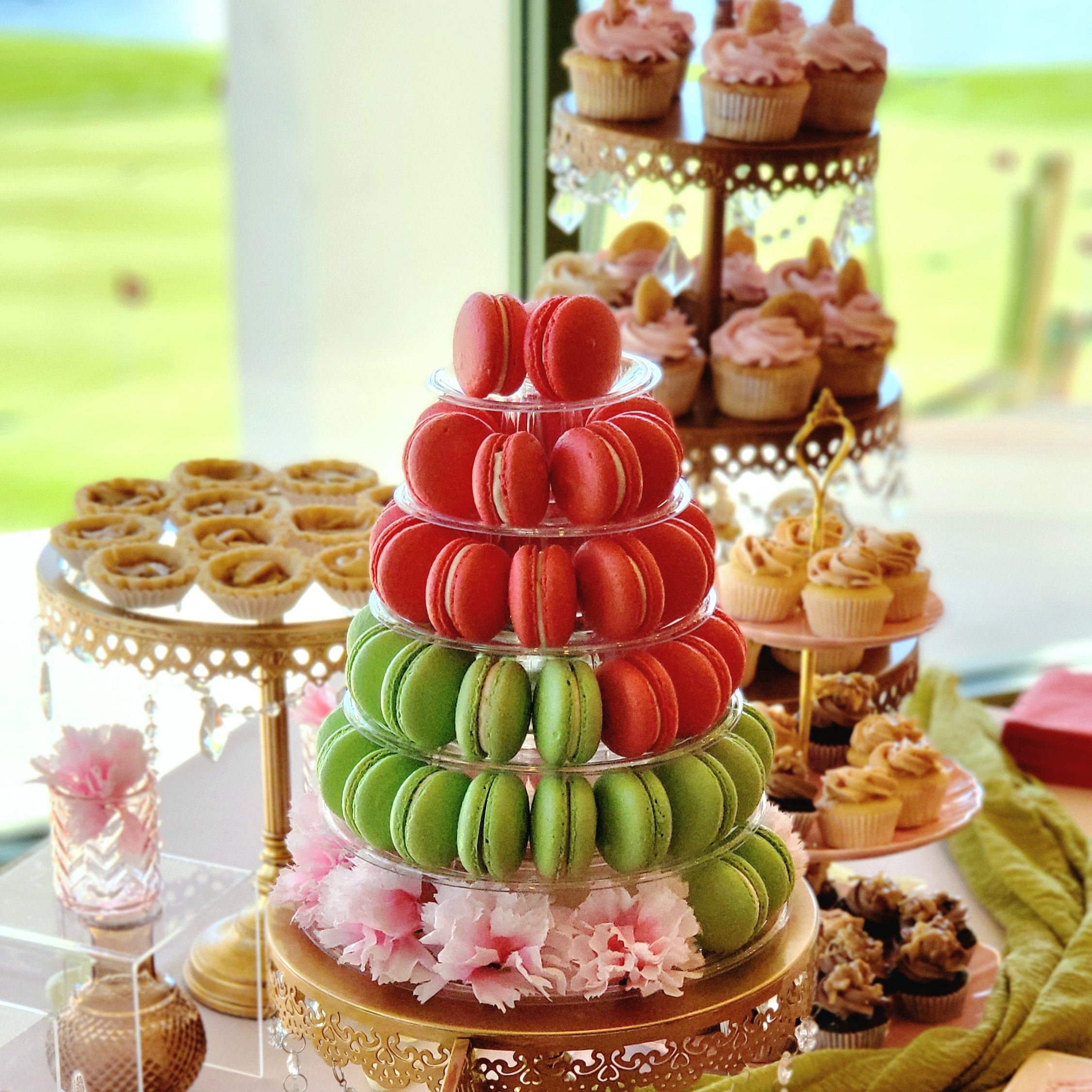 Macaron tower with other desserts on a dessert table