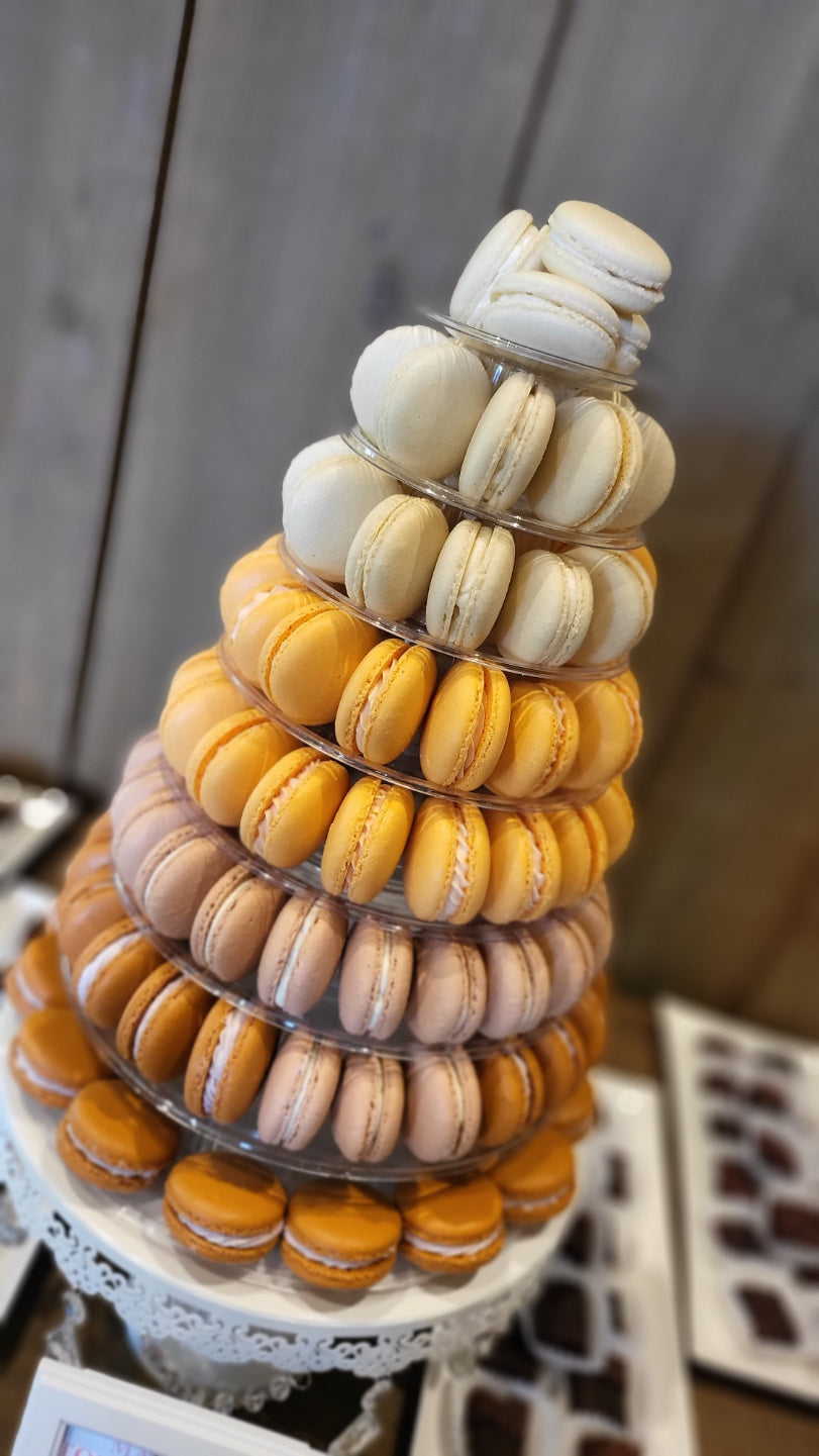 A close up of a fall themed macaron tower for a wedding.